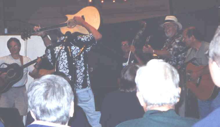 Ted entertains Dan Crary in advanced flatpicking class